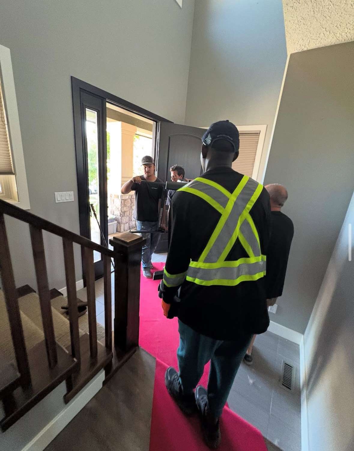 Mover entering a home with floor protection during a move